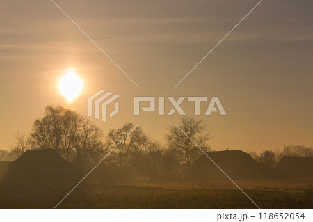 Foggy autumn morning over the village 118652054