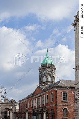 Clock tower of Dublin Castle with distinctive green dome and clock face under blue cloudy sky Clock tower of Dublin Castle with distinctive green dome and clock face under blue cloudy sky 118652276