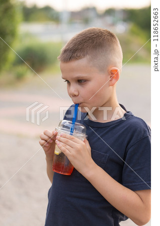 A boy drinks a cold bubble tea A boy drinks a cold bubble tea 118652663