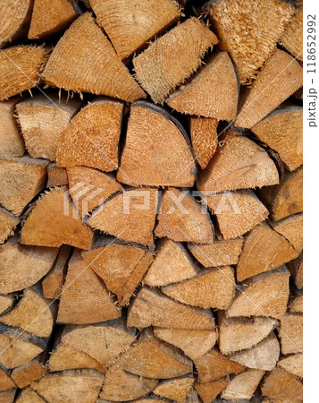 Firewood chopped dry wooden logs woodpile stacked Firewood chopped dry wooden logs woodpile stacked 118652992