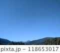 View of Hoverla Mountain in the Carpathians from the countryside grows green grass and a design for drying grass horizontal 118653017