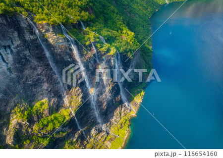 Geiranger Fjord, Norway. Nature in fjords. Traveling by boat on a Norwegian fjord. Scandinavia. Geiranger Fjord, Norway. Nature in fjords. Traveling by boat on a Norwegian fjord. Scandinavia. 118654160