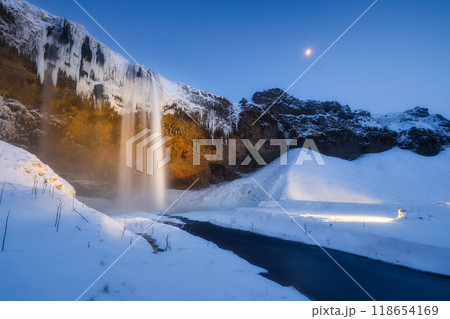 Seljalandsfoss waterfall, Iceland. Icelandic winter landscape. High waterfall and rocks Seljalandsfoss waterfall, Iceland. Icelandic winter landscape. High waterfall and rocks 118654169