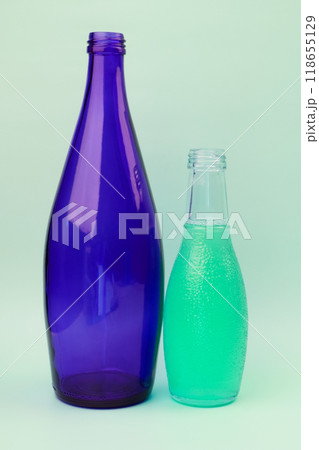 Colorful glass bottle, unusual background Colorful glass bottle, unusual background 118655129