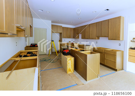 Construction of new kitchen cabinet during home improvement project 118656100
