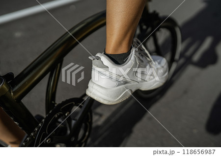close up biker foot wearing athletic footwear 118656987