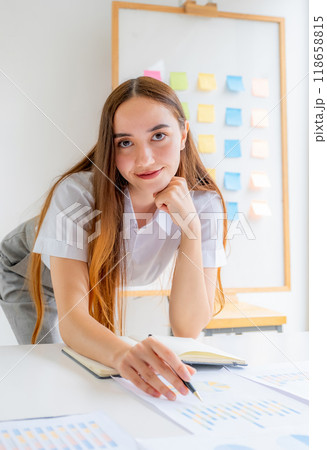 Caucasian businesswoman management work plan strategies to increase business income. Have a finance graph analysis of the new target success Caucasian businesswoman management work plan strategies to increase business income. Have a finance graph analysis of the new target success 118658815