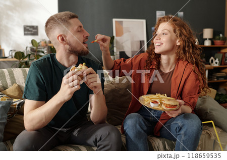 Putting french fries in guy mouth 118659535