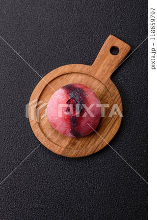 Delicious cold Japanese mochi dessert with colorful rice dough shell and fruit filling 118659797