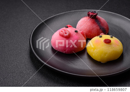 Delicious cold Japanese mochi dessert with colorful rice dough shell and fruit filling 118659807