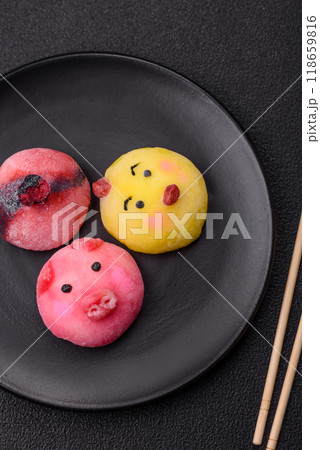 Delicious cold Japanese mochi dessert with colorful rice dough shell and fruit filling 118659816