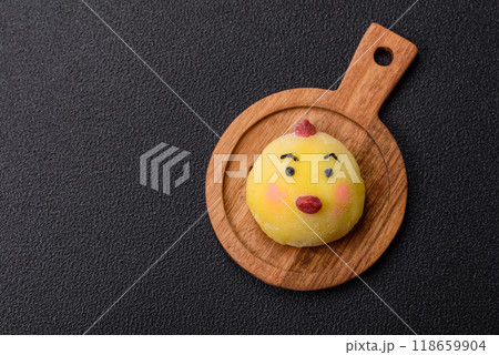Delicious cold Japanese mochi dessert with colorful rice dough shell and fruit filling 118659904
