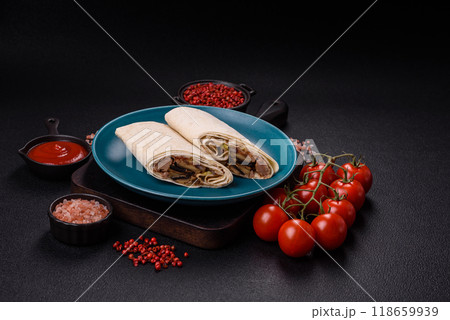 Delicious traditional shawarma or doner kebab with beef, mushrooms Delicious traditional shawarma or doner kebab with beef, mushrooms 118659939