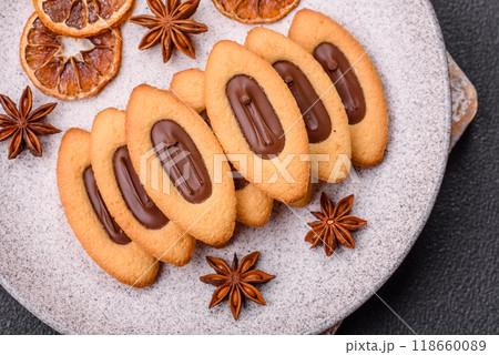 Delicious sweet crispy cookies with chocolate filling in the center Delicious sweet crispy cookies with chocolate filling in the center 118660089