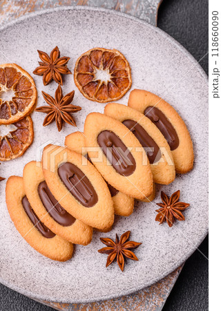 Delicious sweet crispy cookies with chocolate filling in the center Delicious sweet crispy cookies with chocolate filling in the center 118660090