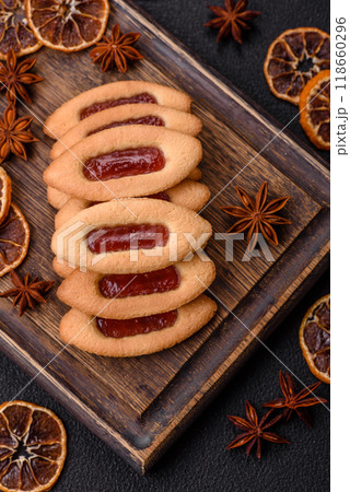 Delicious sweet crispy cookies with jam filling in the center Delicious sweet crispy cookies with jam filling in the center 118660296