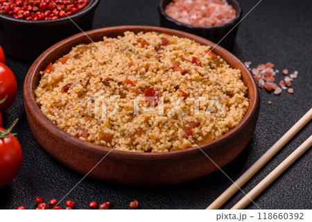 Delicious hot boiled wheat porridge couscous with vegetables 118660392