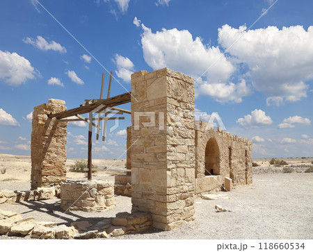 Quseir (Qasr) Amra desert castle (against the sky with clouds) near Amman, Jordan. World heritage with famous fresco's. Built in 8th century, of early Islamic art and architecture Quseir (Qasr) Amra desert castle (against the sky with clouds) near Amman, Jordan. World heritage with famous fresco's. Built in 8th century, of early Islamic art and architecture 118660534