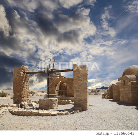Quseir (Qasr) Amra desert castle (against the sky with clouds) near Amman, Jordan. World heritage with famous fresco's. Built in 8th century, of early Islamic art and architecture Quseir (Qasr) Amra desert castle (against the sky with clouds) near Amman, Jordan. World heritage with famous fresco's. Built in 8th century, of early Islamic art and architecture 118660543