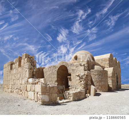 Quseir (Qasr) Amra desert castle (against the sky with clouds) near Amman, Jordan. World heritage with famous fresco's. Built in 8th century, of early Islamic art and architecture Quseir (Qasr) Amra desert castle (against the sky with clouds) near Amman, Jordan. World heritage with famous fresco's. Built in 8th century, of early Islamic art and architecture 118660565