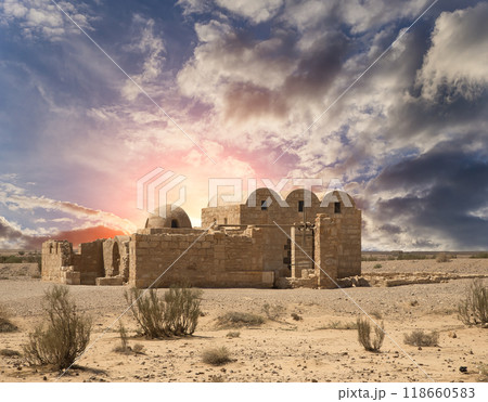 Quseir (Qasr) Amra desert castle (against the sky with clouds) near Amman, Jordan. World heritage with famous fresco's. Built in 8th century, of early Islamic art and architecture Quseir (Qasr) Amra desert castle (against the sky with clouds) near Amman, Jordan. World heritage with famous fresco's. Built in 8th century, of early Islamic art and architecture 118660583