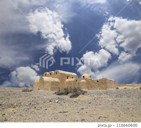 Quseir (Qasr) Amra desert castle (against the sky with clouds) near Amman, Jordan. World heritage with famous fresco's. Built in 8th century, of early Islamic art and architecture Quseir (Qasr) Amra desert castle (against the sky with clouds) near Amman, Jordan. World heritage with famous fresco's. Built in 8th century, of early Islamic art and architecture 118660600