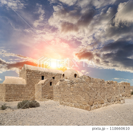 Quseir (Qasr) Amra desert castle (against the sky with clouds) near Amman, Jordan. World heritage with famous fresco's. Built in 8th century, of early Islamic art and architecture Quseir (Qasr) Amra desert castle (against the sky with clouds) near Amman, Jordan. World heritage with famous fresco's. Built in 8th century, of early Islamic art and architecture 118660610