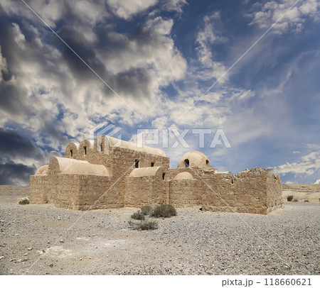 Quseir (Qasr) Amra desert castle (against the sky with clouds) near Amman, Jordan. World heritage with famous fresco's. Built in 8th century, of early Islamic art and architecture Quseir (Qasr) Amra desert castle (against the sky with clouds) near Amman, Jordan. World heritage with famous fresco's. Built in 8th century, of early Islamic art and architecture 118660621