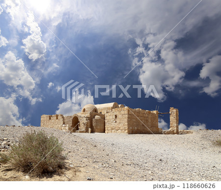 Quseir (Qasr) Amra desert castle (against the sky with clouds) near Amman, Jordan. World heritage with famous fresco's. Built in 8th century,  of early Islamic art and architecture 118660626
