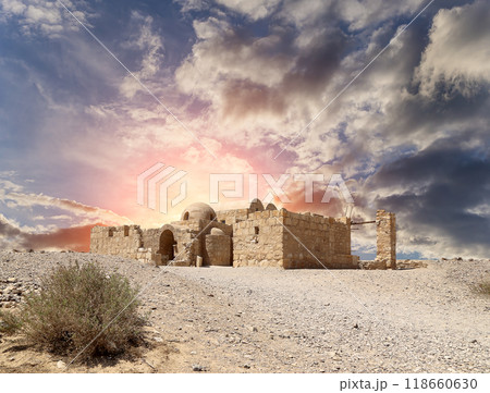 Quseir (Qasr) Amra desert castle (against the sky with clouds) near Amman, Jordan. World heritage with famous fresco's. Built in 8th century, of early Islamic art and architecture Quseir (Qasr) Amra desert castle (against the sky with clouds) near Amman, Jordan. World heritage with famous fresco's. Built in 8th century, of early Islamic art and architecture 118660630