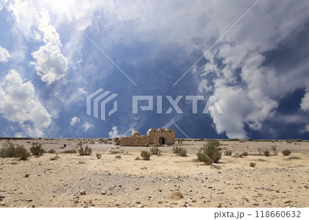 Quseir (Qasr) Amra desert castle (against the sky with clouds) near Amman, Jordan. World heritage with famous fresco's. Built in 8th century,  of early Islamic art and architecture 118660632