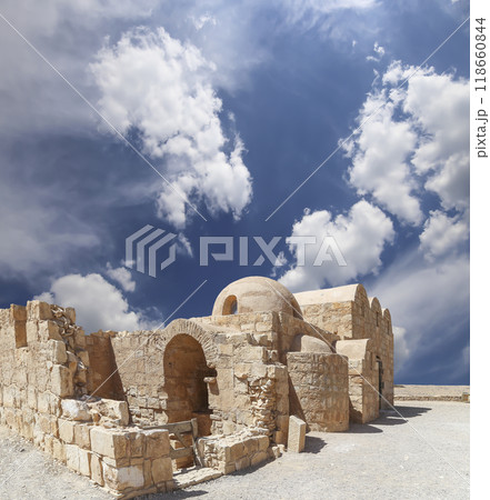 Quseir (Qasr) Amra desert castle (against the sky with clouds) near Amman, Jordan. World heritage with famous fresco's. Built in 8th century, of early Islamic art and architecture Quseir (Qasr) Amra desert castle (against the sky with clouds) near Amman, Jordan. World heritage with famous fresco's. Built in 8th century, of early Islamic art and architecture 118660844