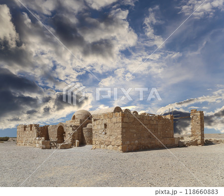 Quseir (Qasr) Amra desert castle (against the sky with clouds) near Amman, Jordan. World heritage with famous fresco's. Built in 8th century, of early Islamic art and architecture Quseir (Qasr) Amra desert castle (against the sky with clouds) near Amman, Jordan. World heritage with famous fresco's. Built in 8th century, of early Islamic art and architecture 118660883