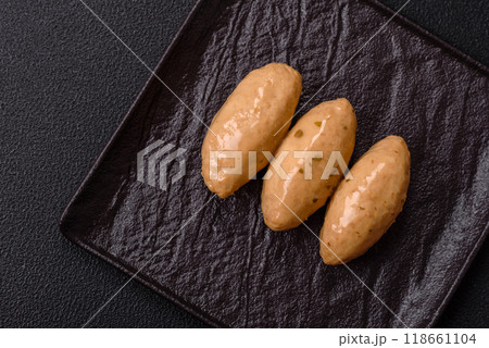 Fish or meat quenelles with delicate mushroom sauce, salt and spices 118661104