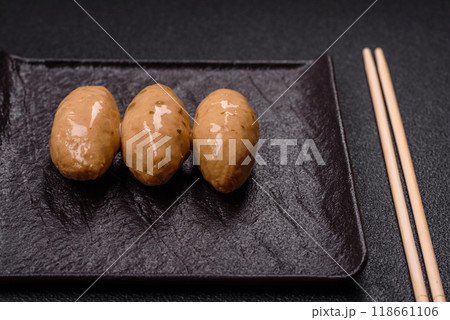 Fish or meat quenelles with delicate mushroom sauce, salt and spices Fish or meat quenelles with delicate mushroom sauce, salt and spices 118661106