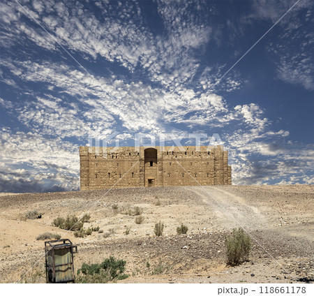 Qasr Kharana (Kharanah or Harrana)-- desert castle in eastern Jordan (100 km of Amman). Built in 8th century AD to be used as caravanserai, a resting place for traders. Against the sky with clouds Qasr Kharana (Kharanah or Harrana)-- desert castle in eastern Jordan (100 km of Amman). Built in 8th century AD to be used as caravanserai, a resting place for traders. Against the sky with clouds 118661178