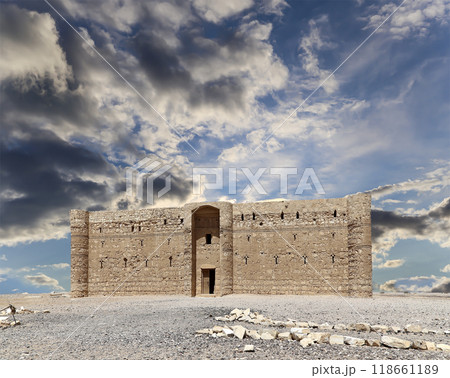 Qasr Kharana (Kharanah or Harrana)-- desert castle in eastern Jordan (100 km of Amman). Built in 8th century AD to be used as caravanserai, a resting place for traders. Against the sky with clouds 118661189
