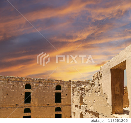 Qasr Kharana (Kharanah or Harrana)-- desert castle in eastern Jordan (100 km of Amman). Built in 8th century AD to be used as caravanserai, a resting place for traders. Against the sky with clouds 118661206