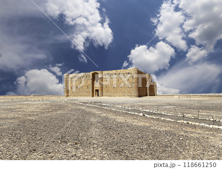 Qasr Kharana (Kharanah or Harrana)-- desert castle in eastern Jordan (100 km of Amman). Built in 8th century AD to be used as caravanserai, a resting place for traders. Against the sky with clouds 118661250