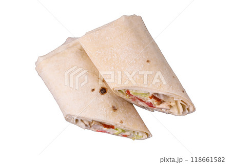 Delicious traditional shawarma or doner kebab with chicken Delicious traditional shawarma or doner kebab with chicken 118661582