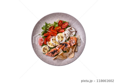 Delicious fresh caesar salad with salmon, lettuce, tomatoes and egg Delicious fresh caesar salad with salmon, lettuce, tomatoes and egg 118661602