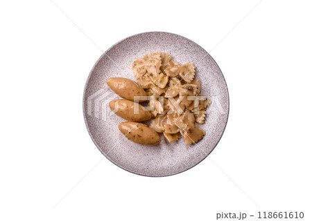 Fish or meat quenelles with delicate mushroom sauce, salt and spices 118661610