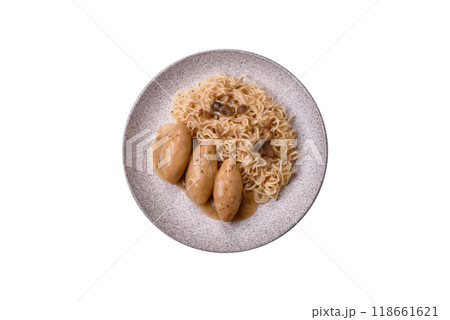 Fish or meat quenelles with vegetables, salt and spices in mushroom sauce 118661621