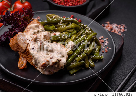 Asian food baked chicken breast with green beans, sesame seeds and sauce Asian food baked chicken breast with green beans, sesame seeds and sauce 118661925