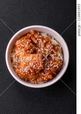 Asian food boiled rice with meat with sweet and sour sauce, spices and herbs Asian food boiled rice with meat with sweet and sour sauce, spices and herbs 118661953