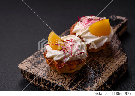 Sweet or sour cupcake with cream cheese, microgreens and filling 118661975