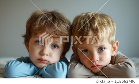 Two young boys with thoughtful expressions. Two young boys with thoughtful expressions. 118662496