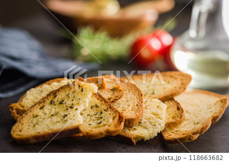 Crispy roasted bruschetta bread on black table. Crispy roasted bruschetta bread on black table. 118663682