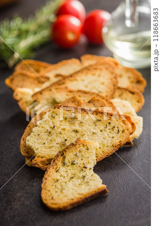 Crispy roasted bruschetta bread on black table. Crispy roasted bruschetta bread on black table. 118663683