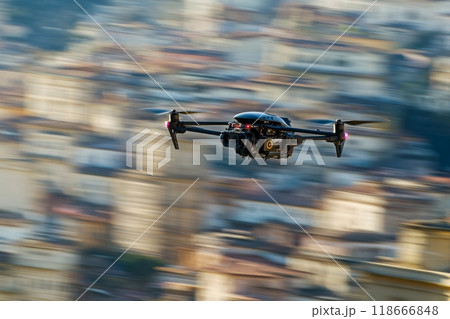 Professional drone flying over cityscape taking photos 118666848